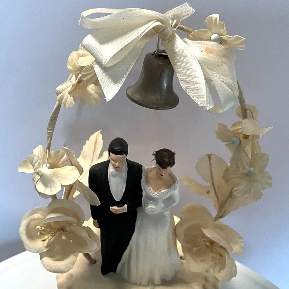 Stunning vintage wedding cake topper; silk bow, chalkware figures dated 1958